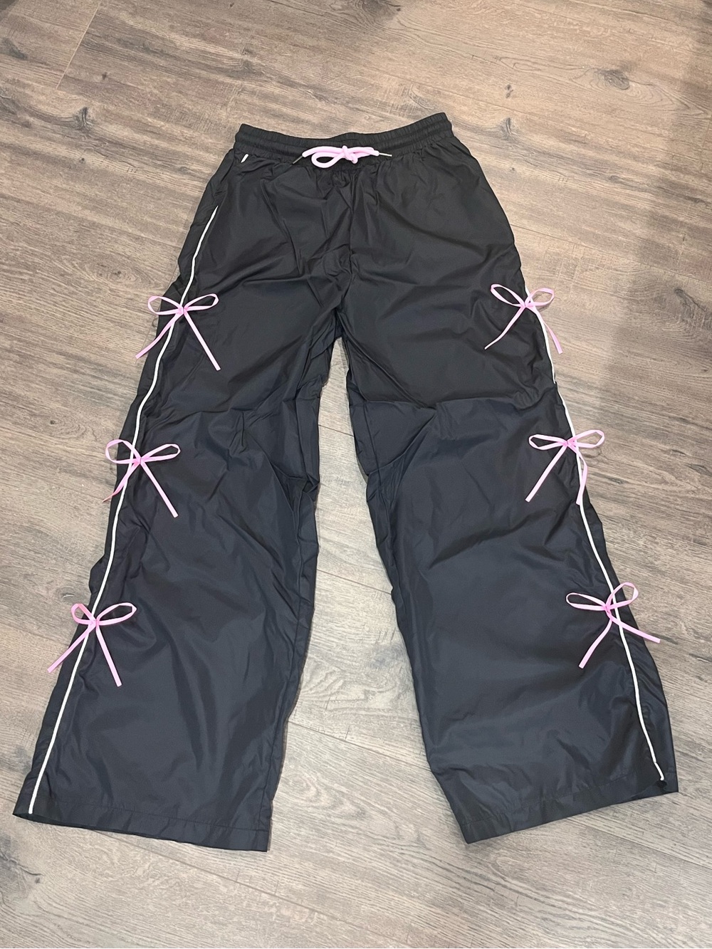 Black Woman’s Bow-Accent Track Pants - Brand Unknown